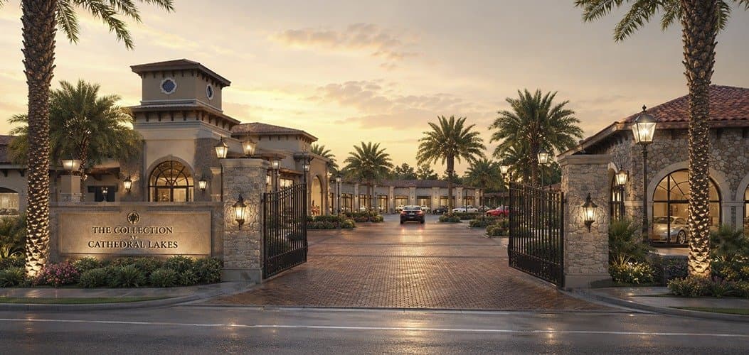 Cobbled, lushly landscaped gated entry drive into The Collection