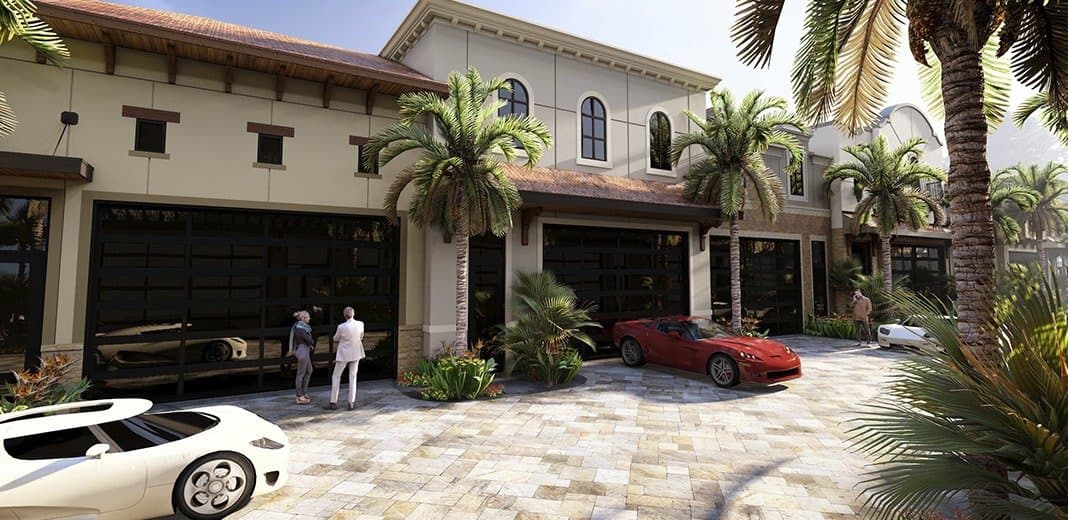 Private showroom courtyard with exotic cars parked outside open garage doors